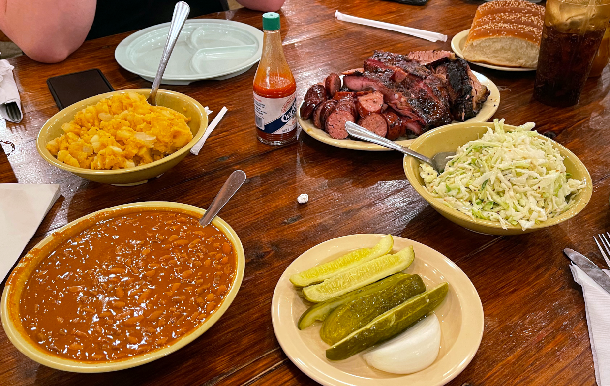 A table full of food at the Salt Lick barbecue restaurant