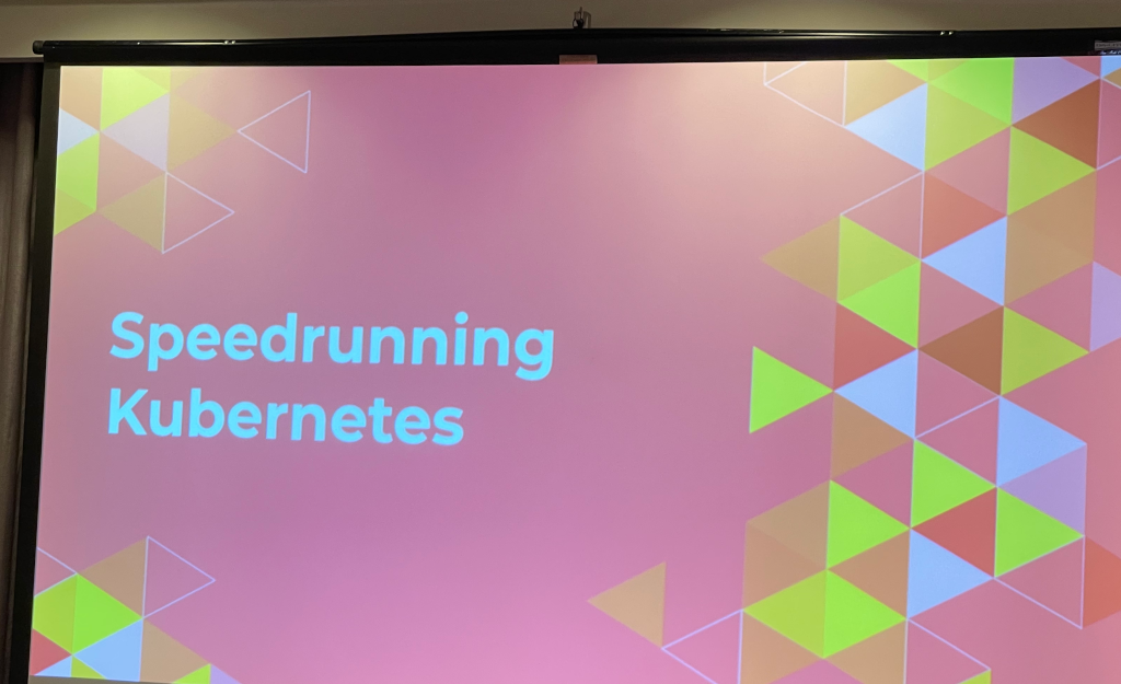 A slide with the session title 'Speedrunning Kubernetes' 