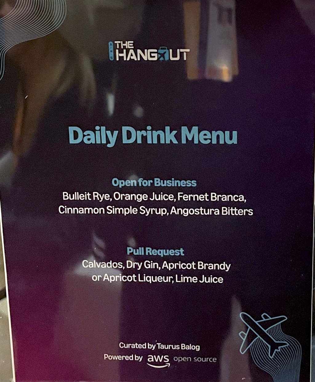 A sign listing two cocktails: Open for Business and Pull Request