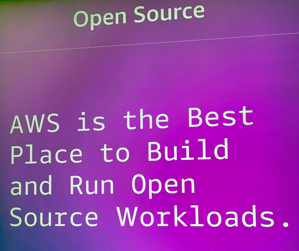 A display with the phrase: AWS is the best place to build and run open source workloads