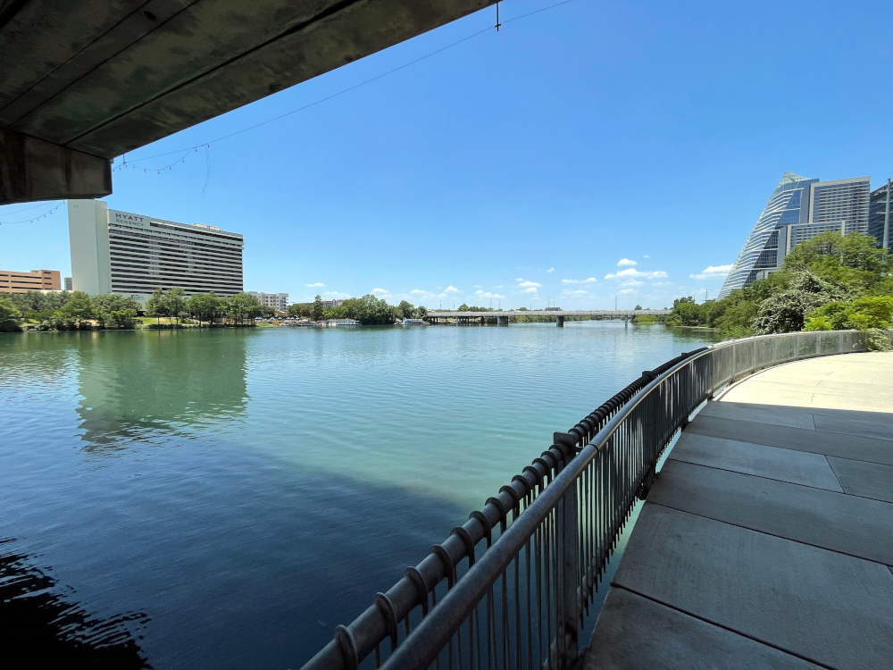 Picture of the wide Brazos river from under the Congress Avenue bridge